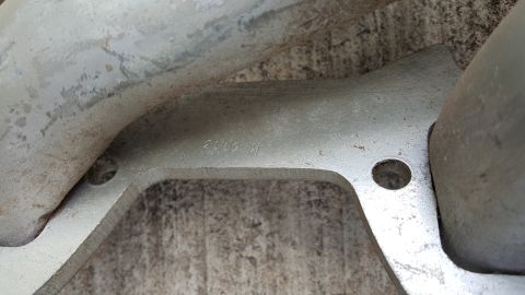 1973 Ford F-100 - A close-up view of a metal component with visible stamped identification numbers.