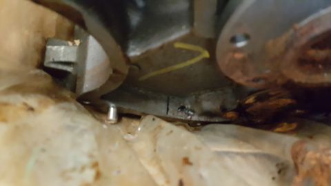 1973 Ford F-100 - Underside view of a mechanical part, possibly from an engine bay.