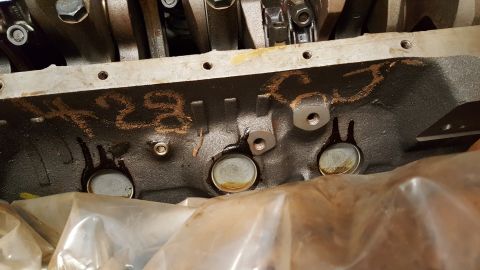 1973 Ford F-100 - The engine block has some chalk markings on it, possibly indicating a part number or designation.