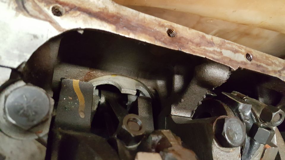 Engine crankshaft and connecting rods with visible damage