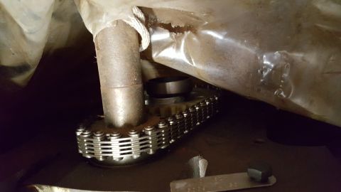 1973 Ford F-100 - Engine timing chain and gears are visible, partially obscured by protective plastic sheeting.