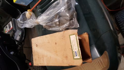 1973 Ford F-100 - Cardboard box with Ford parts inside, some in plastic packaging.