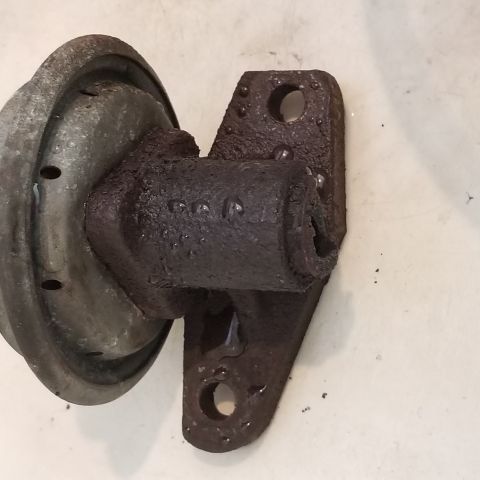 1967 Ford Bronco - This is a close-up view of a corroded automotive part, likely a brake or clutch component.