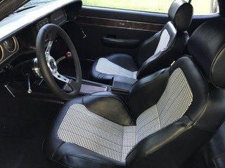1969 Mercury Cougar - Custom interior with houndstooth pattern seats and a Grant steering wheel.