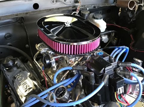 1969 Mercury Cougar - Close-up of an engine a chrome air cleaner and Roush valve covers, with blue spark plug wires visible.