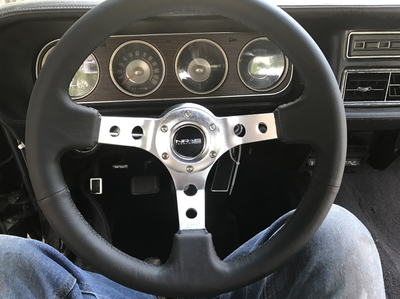 1969 Mercury Cougar - The interior of a 1969 Mercury Cougar shows a custom steering wheel and the instrument cluster.