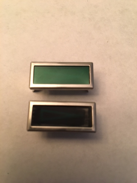 1968 Mercury Cougar - Two rectangular trim pieces, likely for an automotive interior, are shown with green and black inserts.