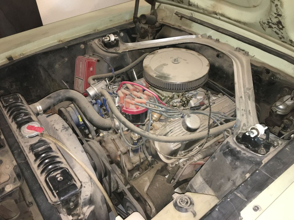 1968 Mercury Cougar engine bay with a V8 engine, air cleaner, radiator, and distributor