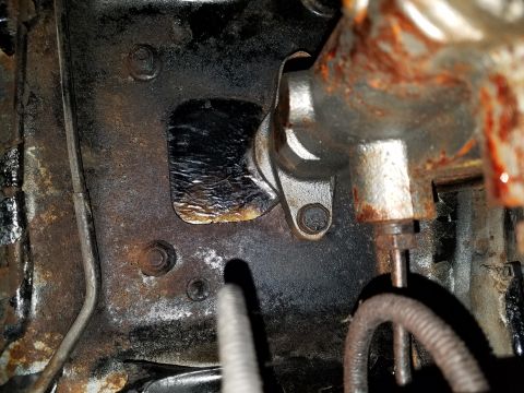 1971 Ford Mustang - Close-up of a corroded brake master cylinder mounting bracket, showing wear and tear.