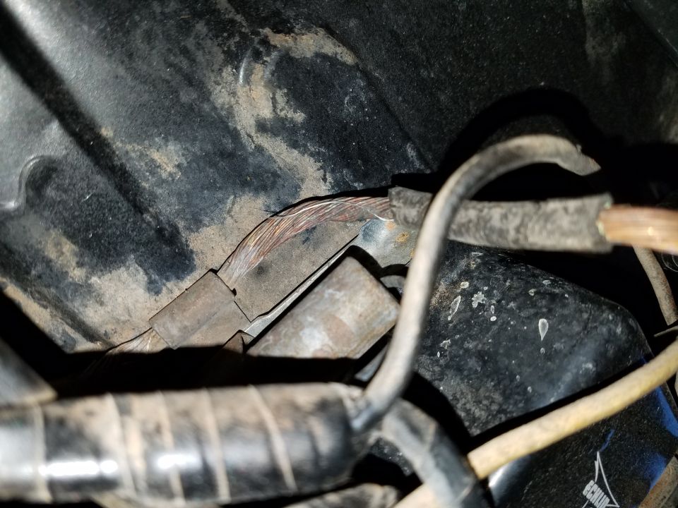 1971 Ford Mustang wiring harness with frayed copper wires and black tape