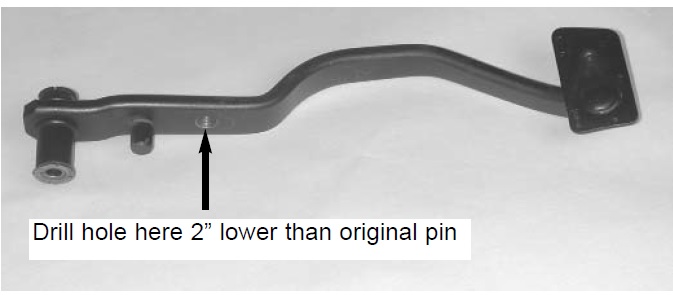 Brake pedal assembly with an arrow pointing to a hole and text indicating to drill a hole 2 inches lower than the original pin. Supermotors.net logo is visible
