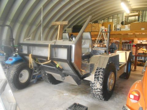 1992 Ford Bronco - This custom-built vehicle features a metal body and large off-road tires, suggesting it is designed for challenging terrain.