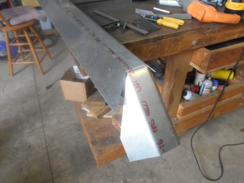 1992 Ford Bronco - Metal fabrication project underway on a workbench with various tools and supplies.