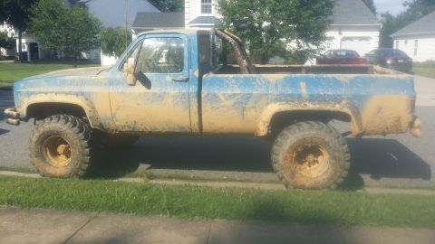 1978 Chevrolet C/K Pickup - This heavily muddied pickup truck appears to have seen some off-road action.
