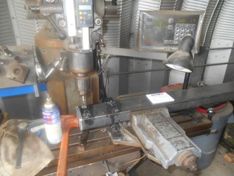 1992 Ford Bronco - A workshop scene shows a milling machine in operation, with metal shavings visible on the work surface.