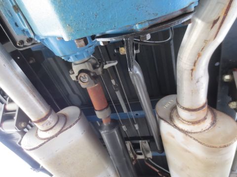 1967 Ford F-250 - Undercarriage detail showing dual exhaust system and driveshaft components.