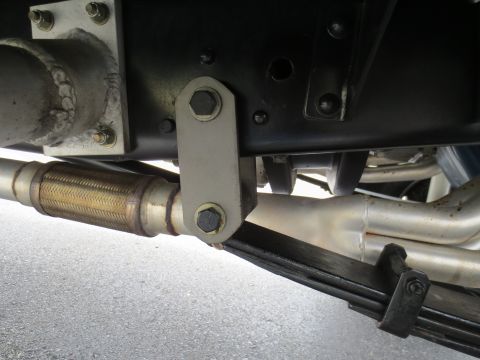 1967 Ford F-250 - Undercarriage view of a truck's suspension and exhaust system.