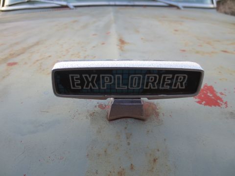 1967 Ford F-250 - The 'Explorer' emblem is visible on the hood of a vehicle with significant rust and wear.
