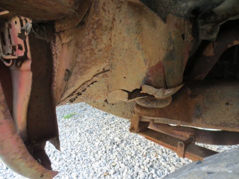 1967 Ford F-250 - Close-up view of severe rust damage on a truck's frame and suspension components.
