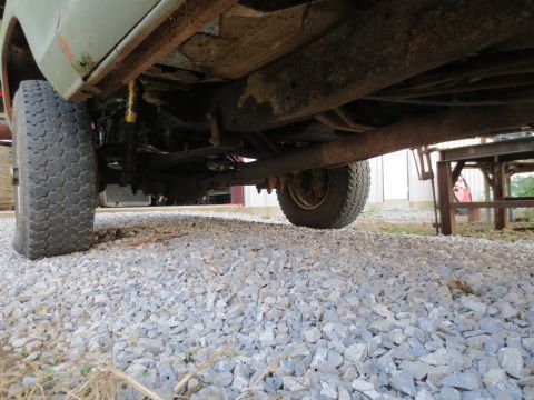 1967 Ford F-250 - Undercarriage view of a 1967 Ford F-250, showing the frame, suspension, and tires.