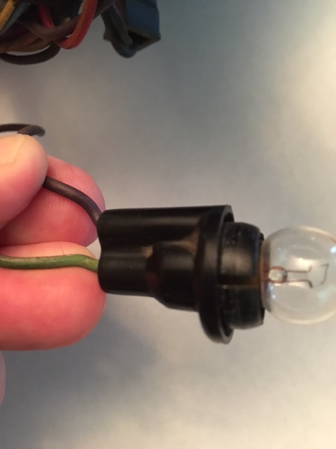 1968 Mercury Cougar - Close-up of automotive wiring and a light bulb socket.