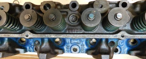 1968 Mercury Cougar - Close-up of an engine cylinder head, showing valve springs and part numbers cast into the metal.