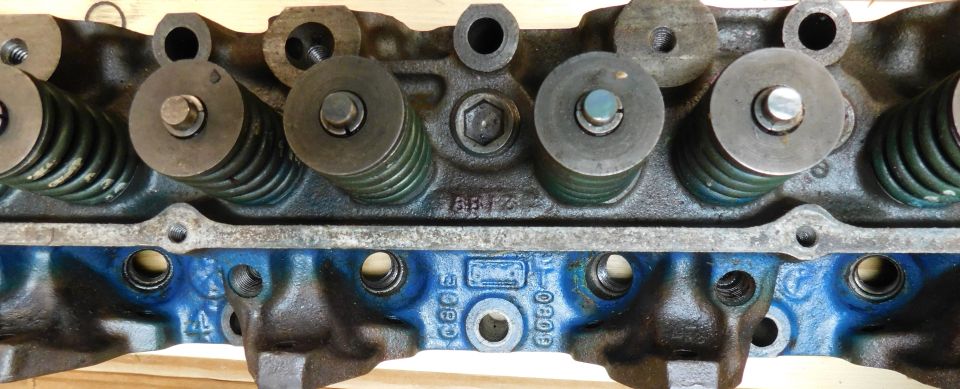 Engine cylinder head with valve springs and visible casting marks