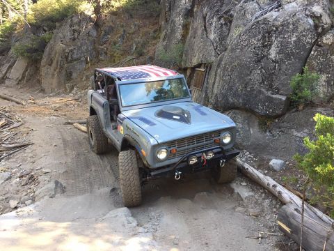 1979 Ford Bronco - This modified Ford Bronco navigates a challenging off-road path.
