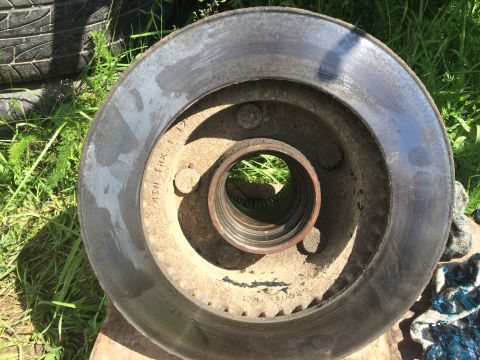1993 Ford Bronco - This is a worn brake rotor with minimum thickness stamped on the surface.