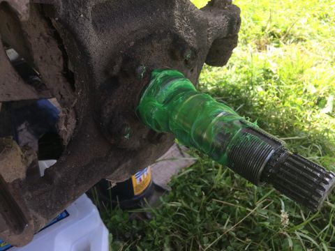 1993 Ford Bronco - Close-up of a greased axle shaft, likely undergoing maintenance.