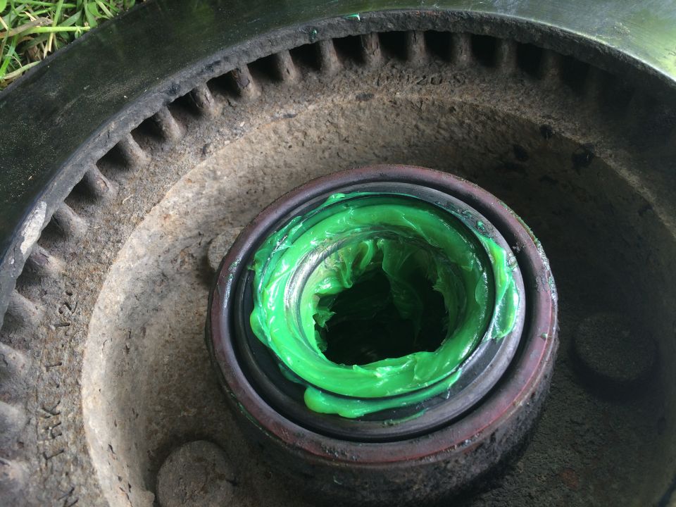 Wheel hub with bearing packed with green grease