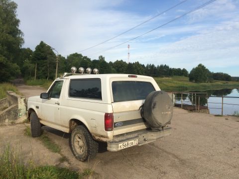 1993 Ford Bronco - This 1993 Ford Bronco is parked by the water on a dirt road.