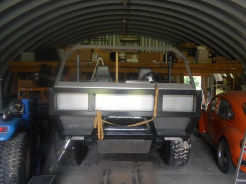 1992 Ford Bronco - Custom amphibious vehicle interior and rear view, parked inside a garage with another vehicle.
