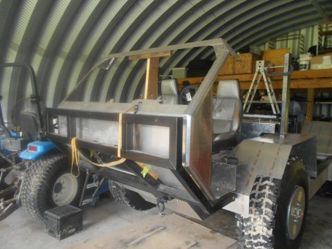 1992 Ford Bronco - This custom-built vehicle is under construction inside a metal Quonset hut garage.