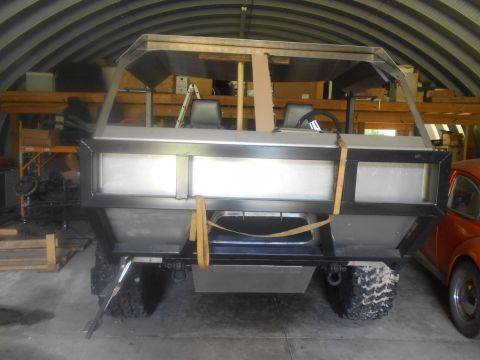 1992 Ford Bronco - This custom vehicle build is in a workshop, with another orange vehicle visible to the right.