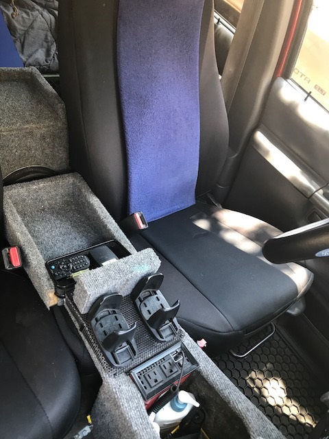 2000 Ford Explorer - Interior view of a vehicle's custom center console, equipped with various accessories and power outlets.