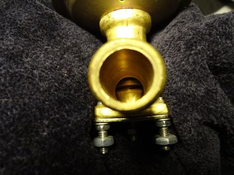 1967 Mercury Cougar - A brass fitting, possibly a valve or connector, is shown in detail against a dark background.
