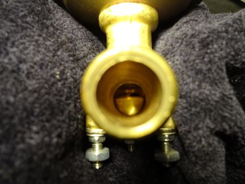 1967 Mercury Cougar - Close-up view of a brass valve component, showing its internal workings.