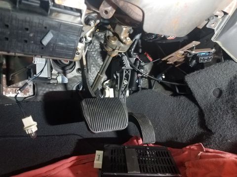 2003 Mercury Marauder - Close-up view of the driver's side footwell, showing pedals and exposed components.