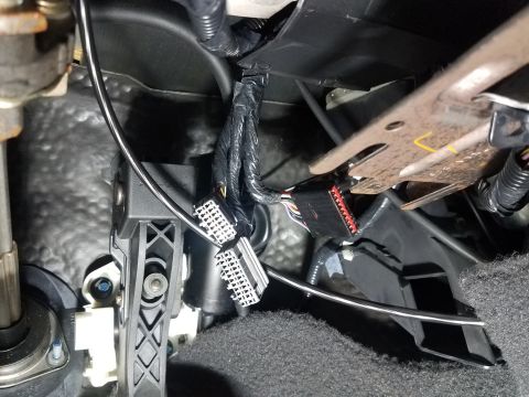 2003 Mercury Marauder - Close-up view of a vehicle's interior wiring harness and connectors.