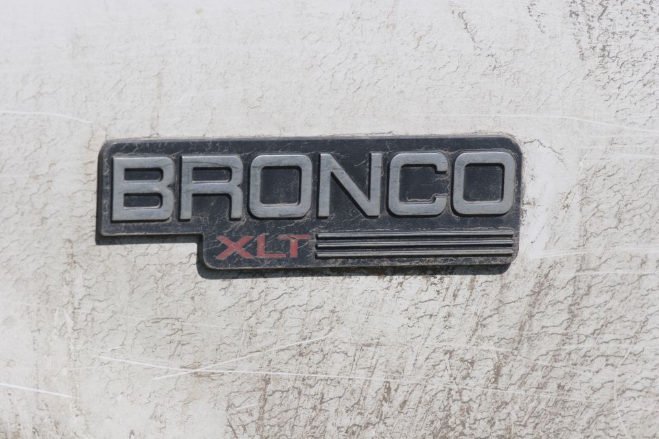 Bronco XLT badge on a white vehicle