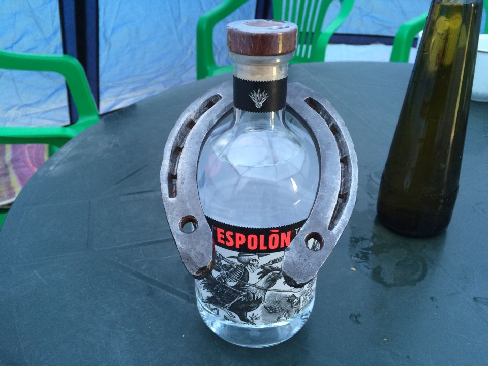 Bottle of Espolon tequila with a horseshoe around the neck.