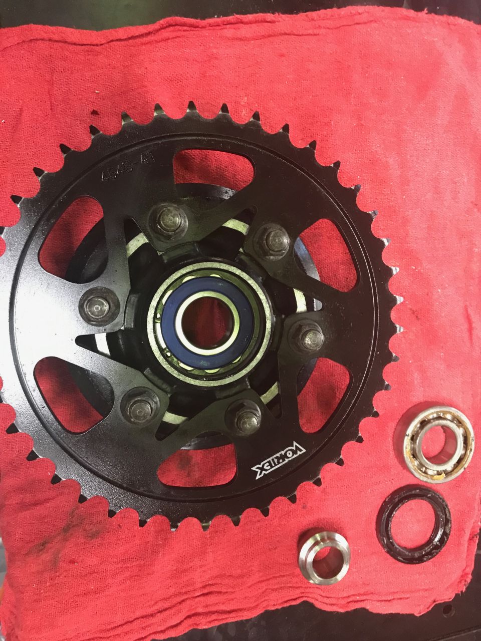 1998 ZX9R wheel lollypop red over super chrome base powder coat, new rotors, new bearings, new seals