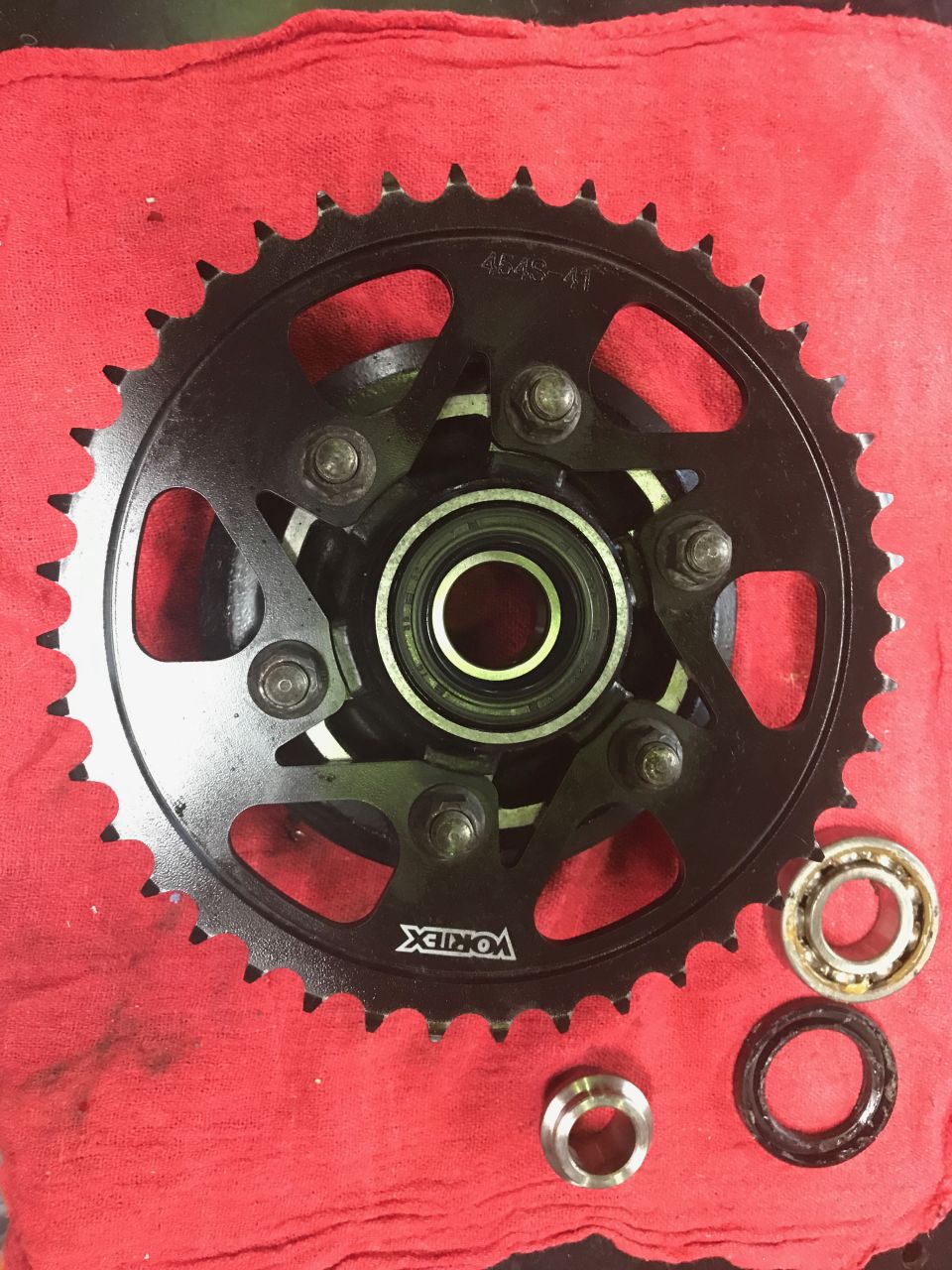 1998 ZX9R wheel lollypop red over super chrome base powder coat, new rotors, new bearings, new seals