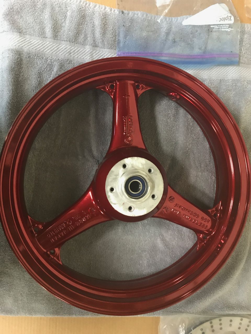 1998 ZX9R wheel lollypop red over super chrome base powder coat, new rotors, new bearings, new seals