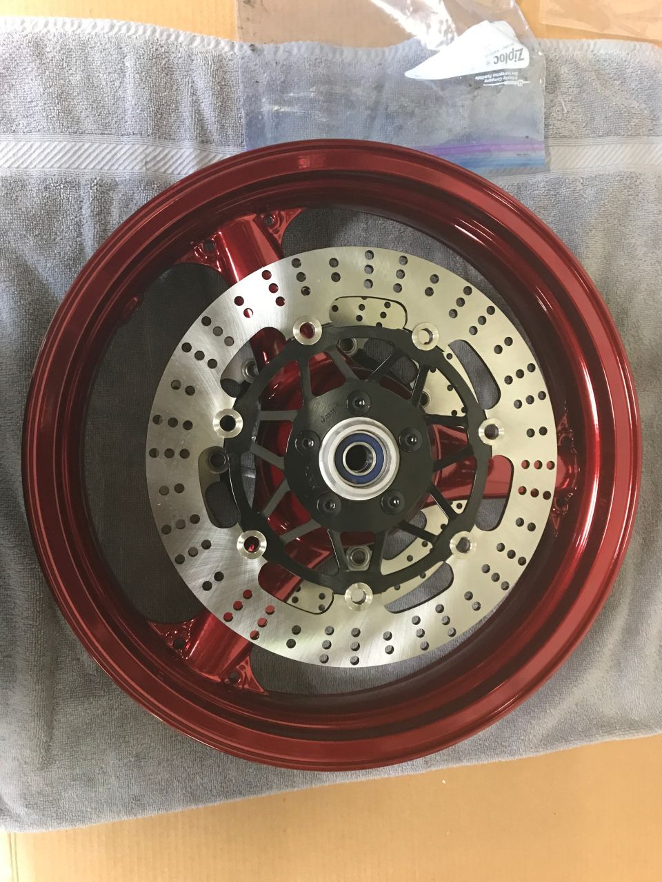1998 ZX9R wheel lollypop red over super chrome base powder coat, new rotors, new bearings, new seals