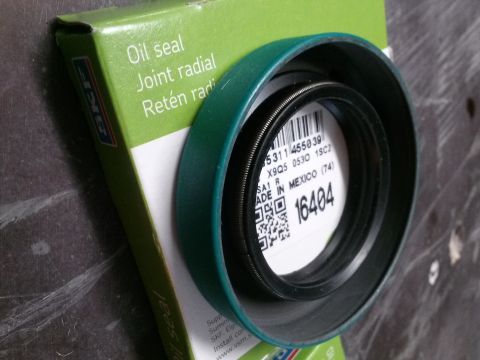 1996 Ford Bronco - A green and white SKF oil seal is shown, with a part number label visible inside the seal. The box indicates "Oil seal Joint radial Retén r…