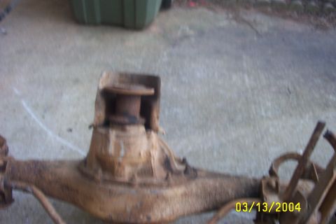 1979 Ford F-150 - Close-up of a rusty rear axle assembly, likely from an older truck.