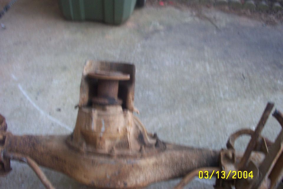 rusty rear axle assembly with differential housing