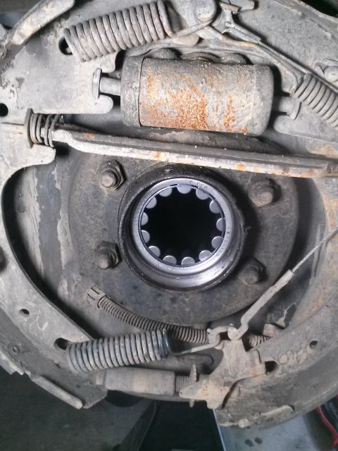 1996 Ford Bronco - This is a close-up view of a drum brake assembly, likely from a 1996 Ford Bronco. The image shows various components including the brake cy…